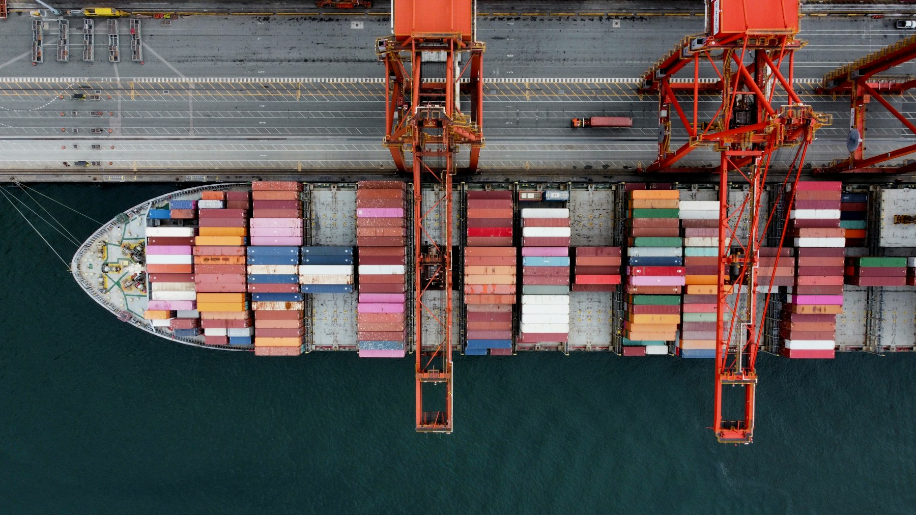 Container vessel being loaded at a port terminal