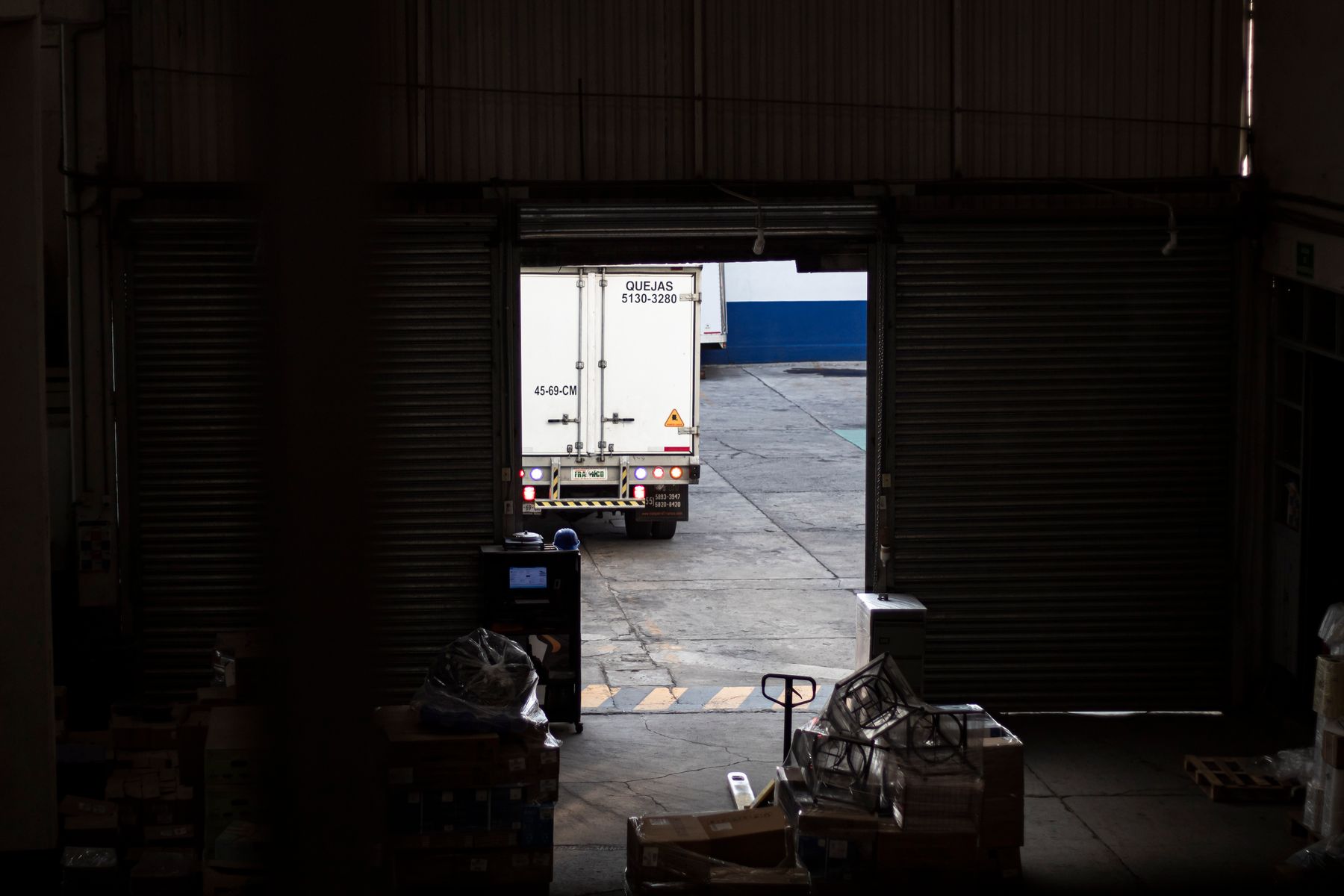 Warehouse loading dock with freight staged for outbound movement