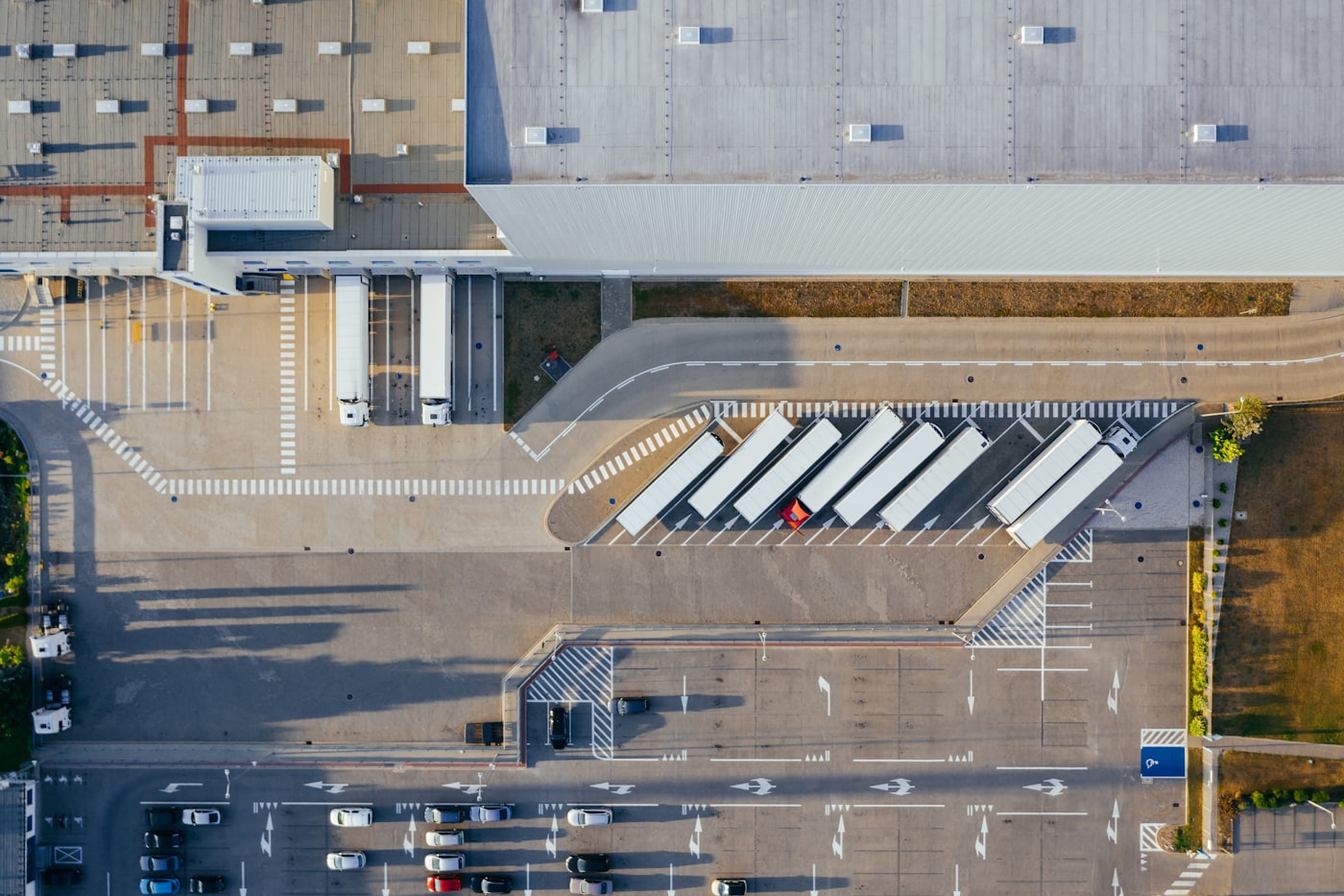 Aerial view of warehouse docks and outbound trucks